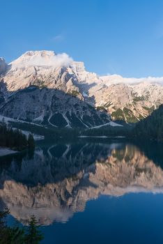 Mountain landscape reflected in the waters of Lake Braies, Italian Dolomites in South Tyrol