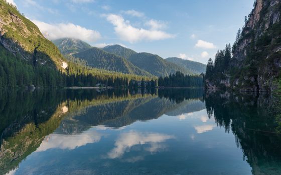 Mountain landscape reflected in the waters of Lake Braies, Italian Dolomites in South Tyrol