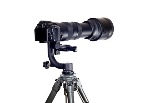 Horizontal shot of a Gimbal Tripod Head holding a digital camera with a long telephoto zoom lens on a white background.