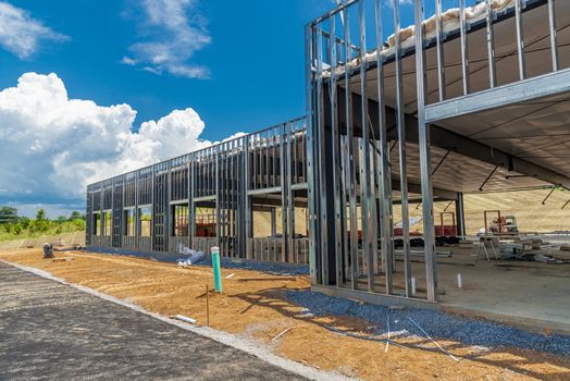 Horizontal shot of the metal framework for a new commercial building under construction.