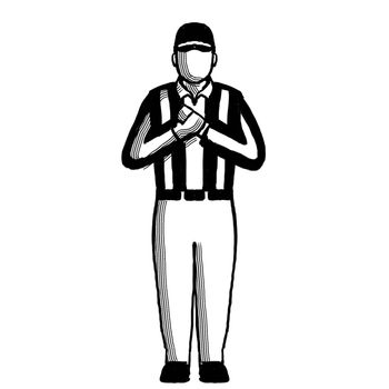 Retro style illustration of an American football referee or official with hand signal showing holding sign on isolated background done in black and white.