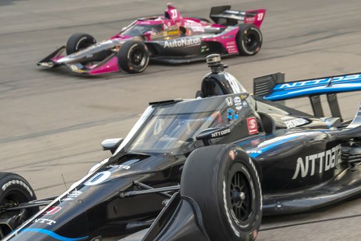FELIX ROSENQVIST (10) of Värnamo, Sweden races through the turns during the race for the Iowa INDYCAR 250s at Iowa Speedway in Newton, Iowa.