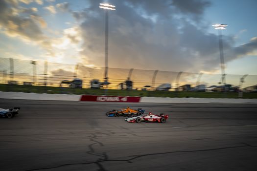 TONY KANAAN (14) of Salvador, Brazil races through the turns during the race for the Iowa INDYCAR 250s at Iowa Speedway in Newton, Iowa.