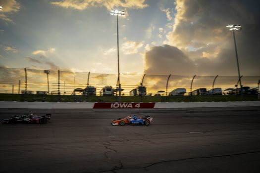 SCOTT DIXON (9) of Auckland, New Zealand races through the turns during the race for the Iowa INDYCAR 250s at Iowa Speedway in Newton, Iowa.