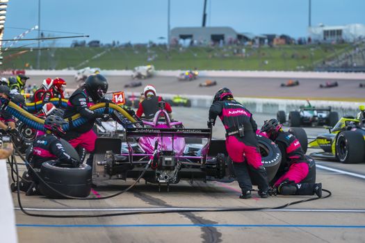JACK HARVEY (60) of Lincoln, England brings his car in for service during the Iowa INDYCAR 250s at Iowa Speedway in Newton Iowa.