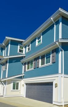 Nice and comfortable neighborhood. New homes, condos, and townhouses on a street in suburbs of Vancouver, Canada