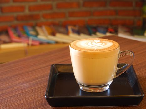 hot milk art coffee in cup in cafe