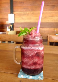 Smoothie berry in glass for a drink in a cafe.