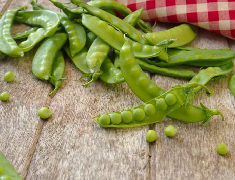 peas on wooden background