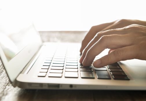 Businessmen's hands typing on laptop keybord