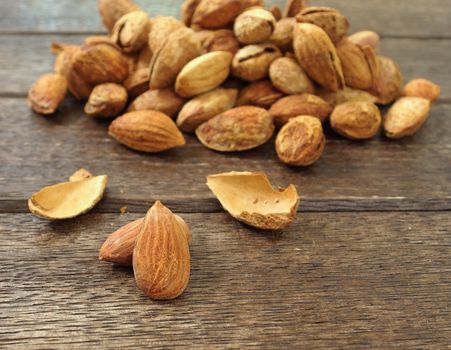 almonds Nutcrackers out put on wood background