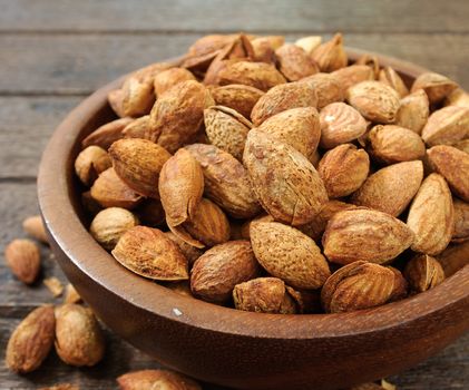 almonds in Wooden bowl on the table