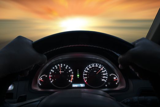 Speed driving at 180 km/h on the road at sunset.