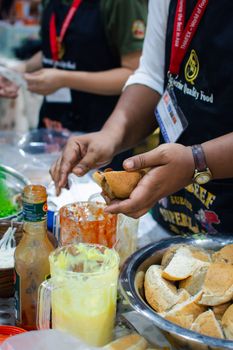 Bangkok, Thailand - May 28, 2016 : Unidentified chef cooking a food for show and sale to customers in the coffee and food exibition show event OTOP.