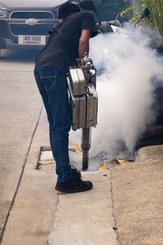 Bangkok, Thailand - July 3, 2016 : Unidentified people fogging DDT spray for mosquito kill and protect by control mosquito is a carrier of Malaria, Encephalitis, Dengue and Zika virus in village.