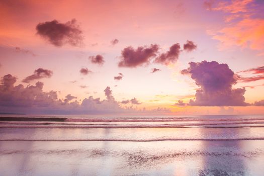 Glowing pink majestic sunset over tropical sea, beautiful natural background