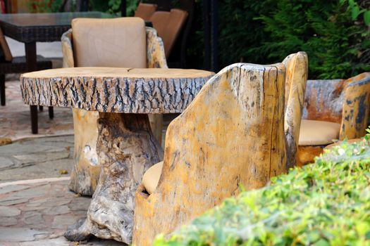 raw wood table and chairs outside