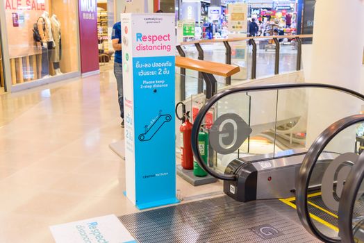 Bangkok , Thailand - 15 July, 2020 : Social distancing stage censor check at escalator of Central RAMA 9 super store