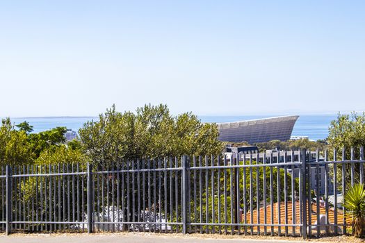 Famous Cape Town Stadium behind fence in Cape Town, South Africa.