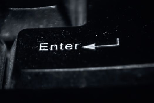 Macro shot of enter key on keyboard.