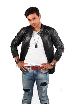 A confident looking young Indian guy, on white studio background.