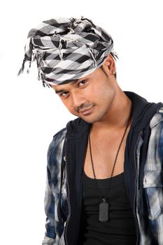 A handsome young Indian guy with a style, on white studio background.