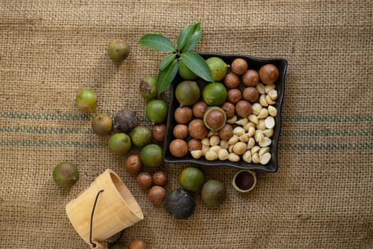 Macadamia nuts on sacks in natural light.