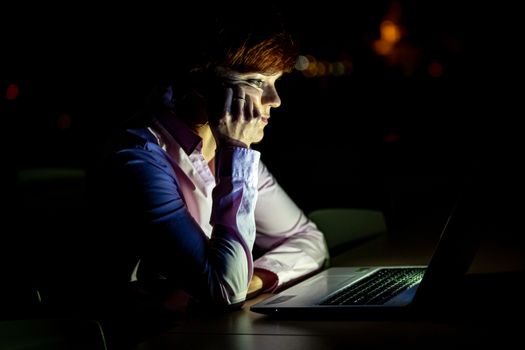 Young beautiful woman on a university lecture working on a white laptop