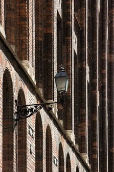 House facade with street lamp.