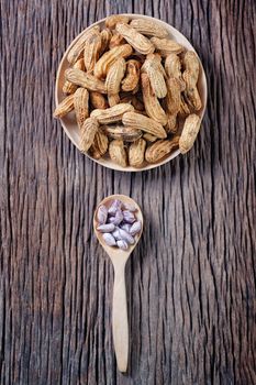 Peanuts on blue wood background