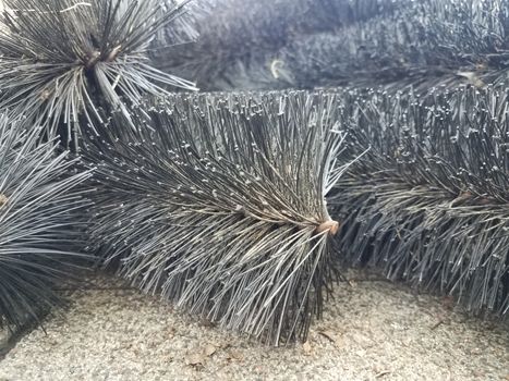 black pipe cleaner and gutter with roof shingles on house