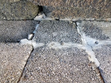 grey cement steps or stairs with damage or cracks