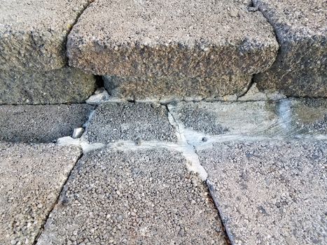 grey cement steps or stairs with damage or cracks