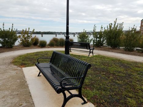 metal park benches and Wilson bridge in Alexandria, Virginia