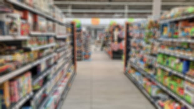 Abstract blurring of supermarket aisles. Creative theme with blurred background and bokeh for themed posters, banners and screensavers