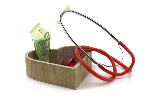 Concept of healthcare and medical costs with stethoscope and euro banknotes money with copy space over white background