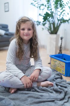 Portrait of a cute little Caucasian girl child with disheveled hair.