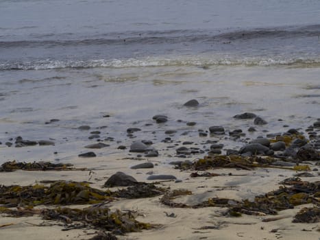 Rough Icelandic Coast in west fjords Iceland, rocks, pebbles , sand and shore, pastel colors