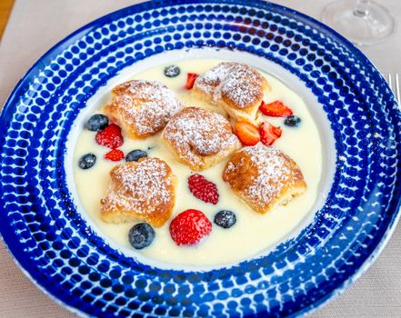buns with vanilla cream and fresh fruit.