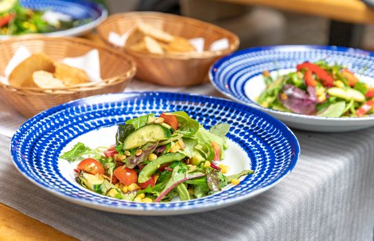 fresh vegetable salad served on a table in a restaurant.