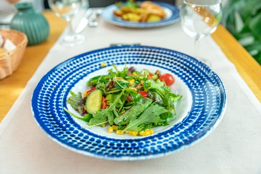 fresh vegetable salad served on a table in a restaurant.