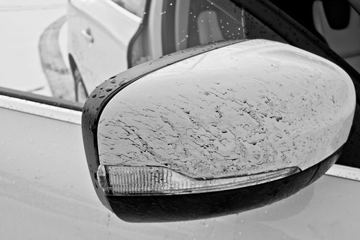 Dusty and dirty white car mirror from a Land Rover.