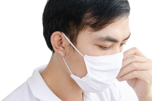 Closeup asian man wearing face mask for protect air polution or virus covid 19, health care and medical concept