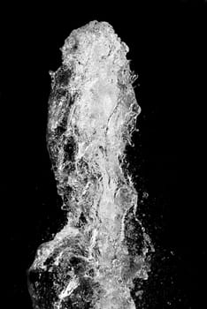 Splash of pouring water isolated over black background