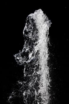 Splash of pouring water isolated over black background