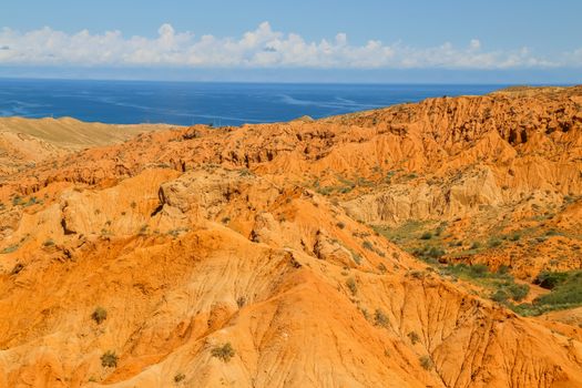 Red sandstone rock formations Seven bulls and Broken heart, Jeti Oguz canyon in Kyrgyzstan, Issyk-Kul region, Central Asia