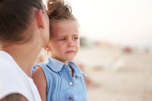 Little girl crying Mother daughter summer beach. Child upset and cry Adorable caucasian kid cry Childhood problems
