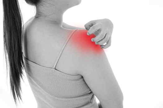 Black and white shot of female scratching her shoulder on isolated white background with red spot. Medical, healthcare for advertising concept.