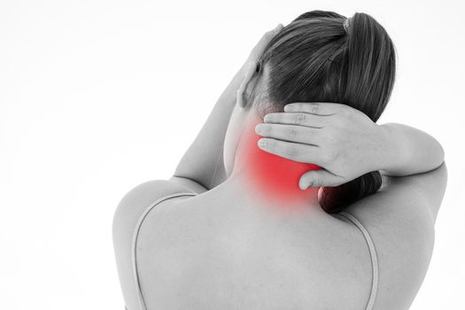 Black and white shot of woman feeling exhausted and suffering from neck and head pain and injury on isolated white background with red spot. Health care and medical concept.