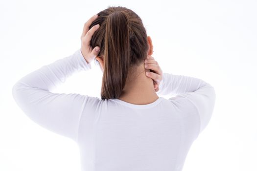 A woman feeling exhausted and suffering from neck and head pain and injury on isolated white background. Health care and medical concept.